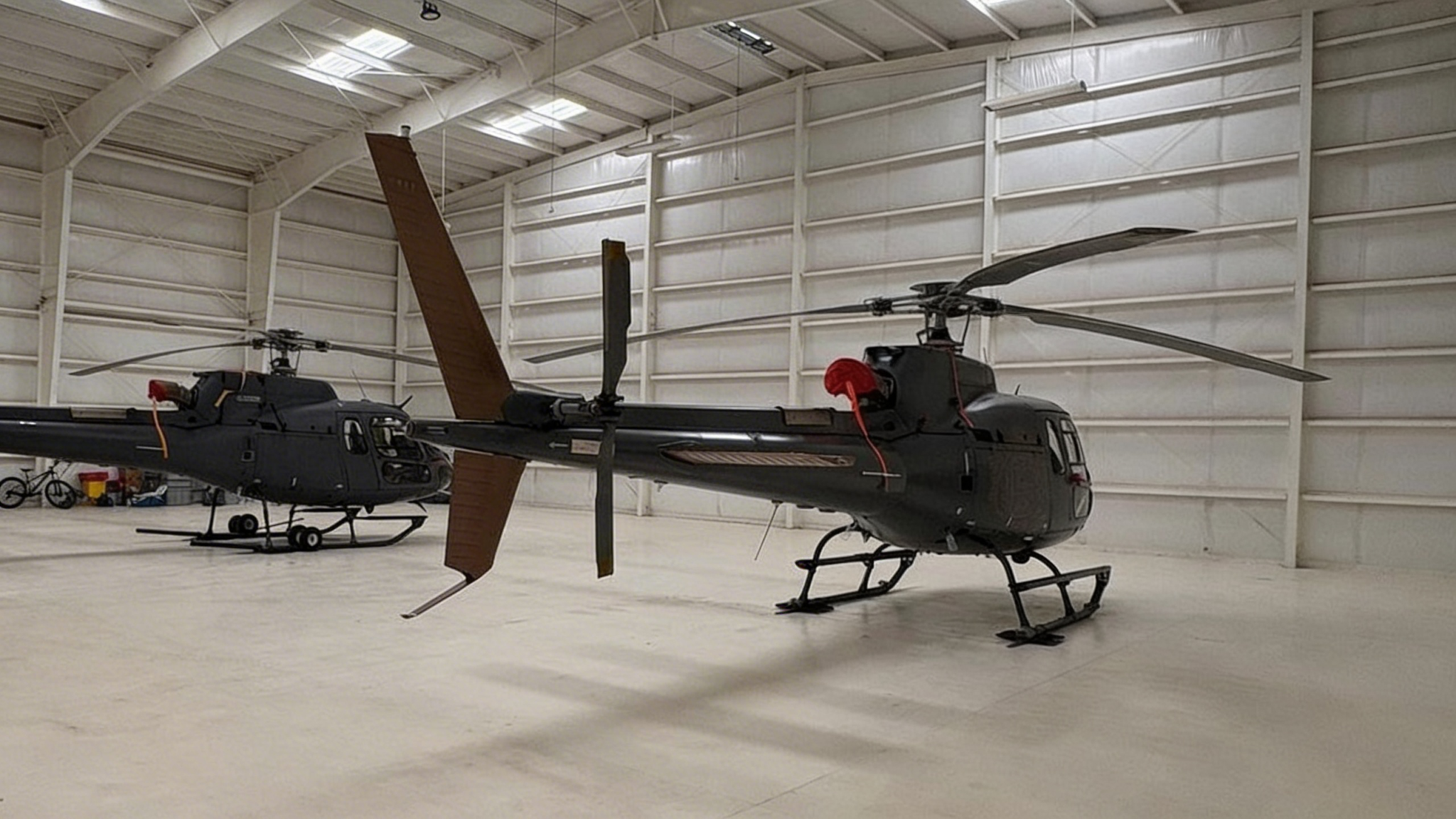 Two helicopters parked inside a hangar in Baja Mexico