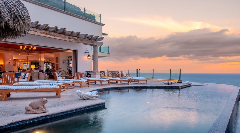 Villa Turquesa poolside with ocean views during sunset in Pedregal Cabo San Lucas