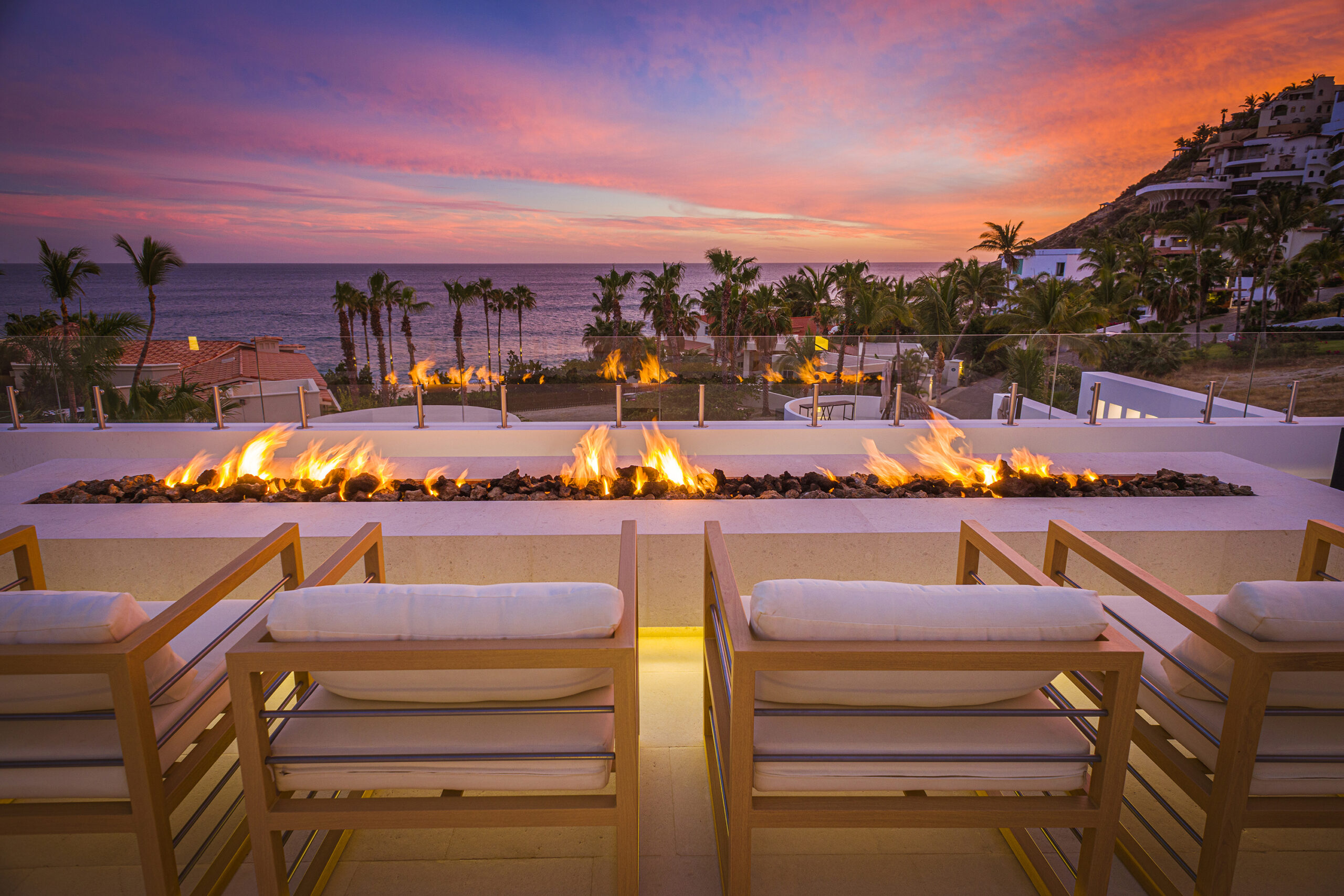Casa Aqua Blanca firepit seating with ocean view during sunset in Punta Bella, Family Friendly Los Cabos