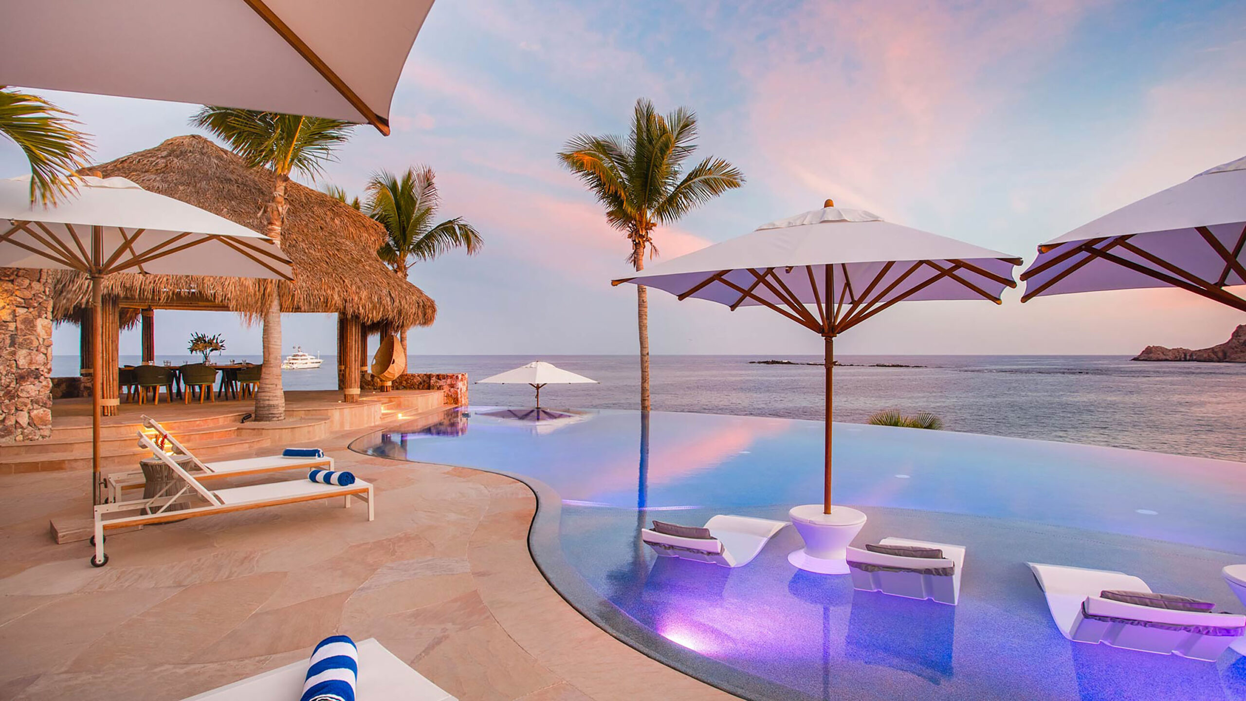 Casa Cielito del Mar a stunning infinity pool merges with ocean views as sunset paints the sky in soft pastels, creating a serene paradise where relaxation