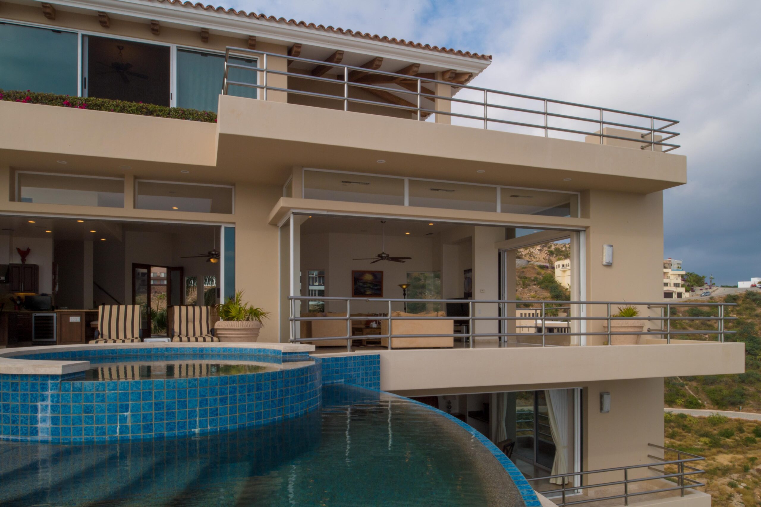 Villa Del Mar pocket doors to pool deck in Pedregal Pacific, Ocean View Los Cabos