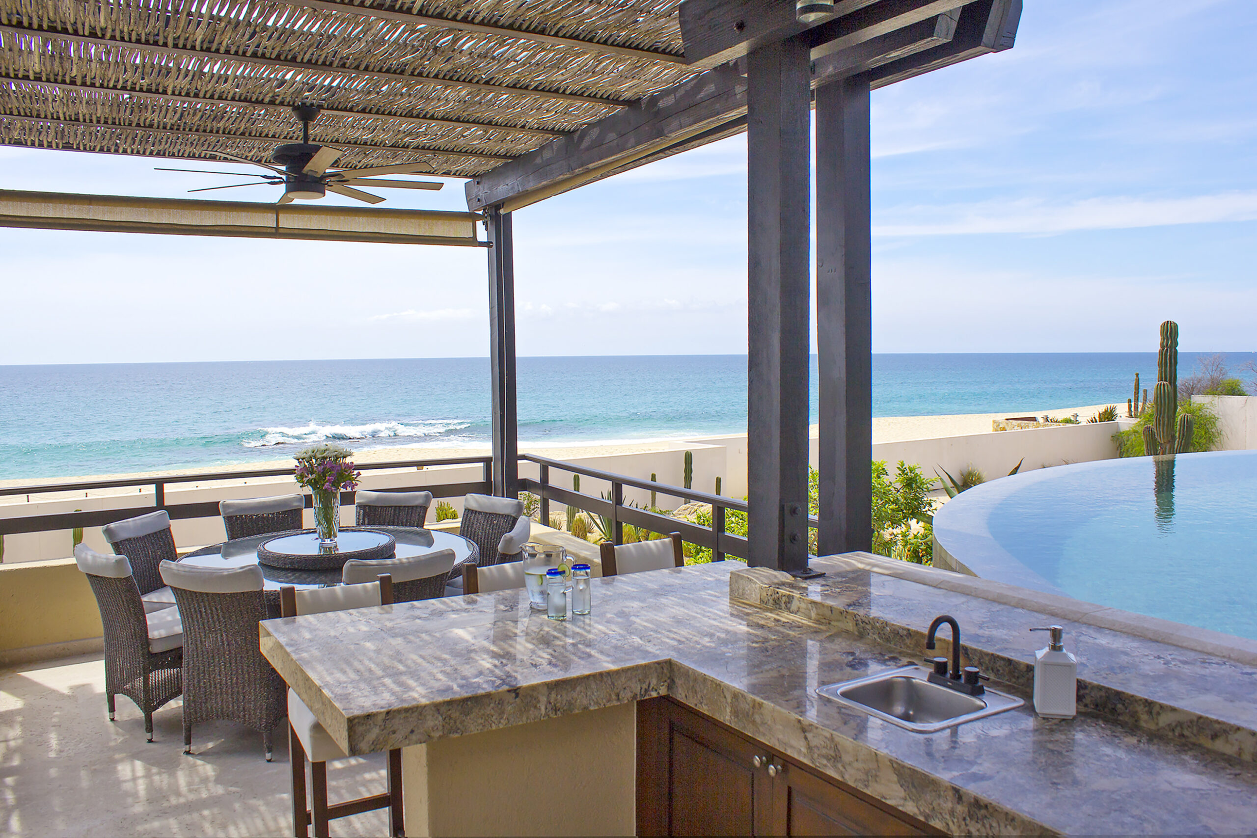 Villa Delfines outdoor dining with beachfront view in Cabo Real, Beachfront Los Cabos