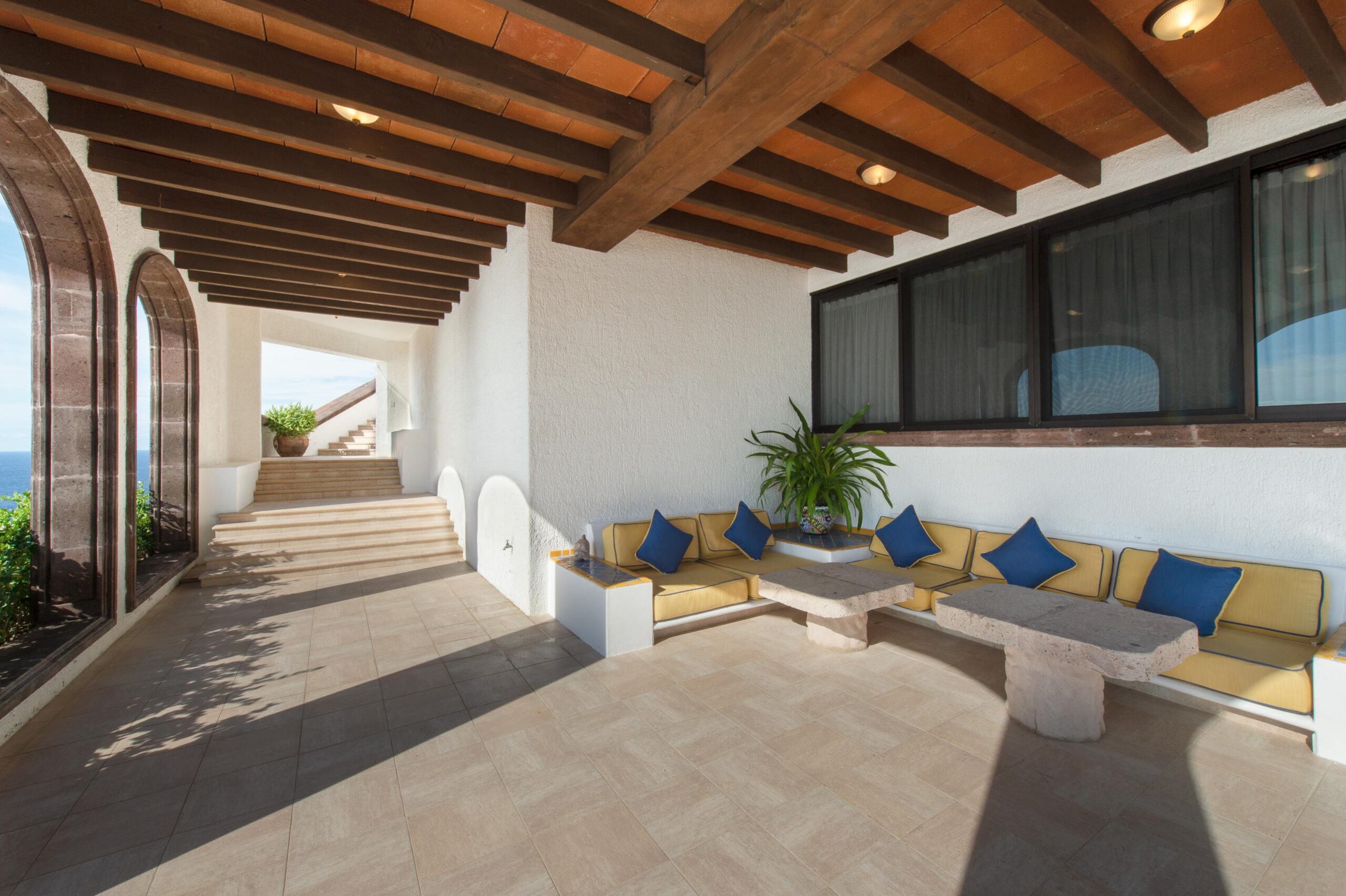 Villa Grande covered patio built in seating in Pedregal Pacific, Oceanfront Los Cabos
