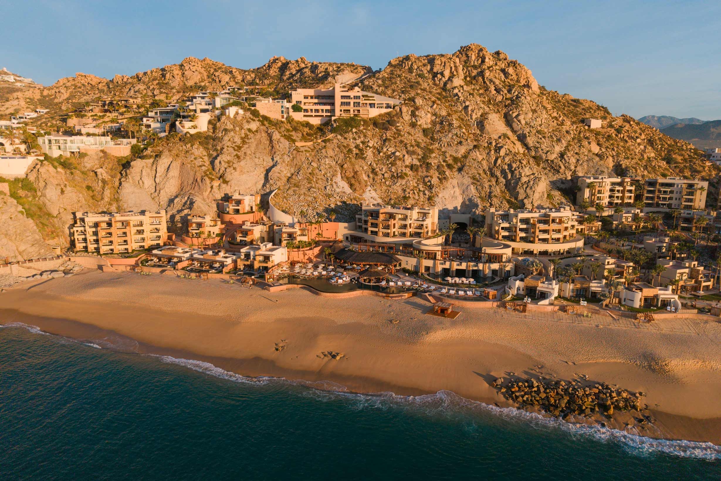 Pedregal beachfront beneath the rocky Pacific hillside