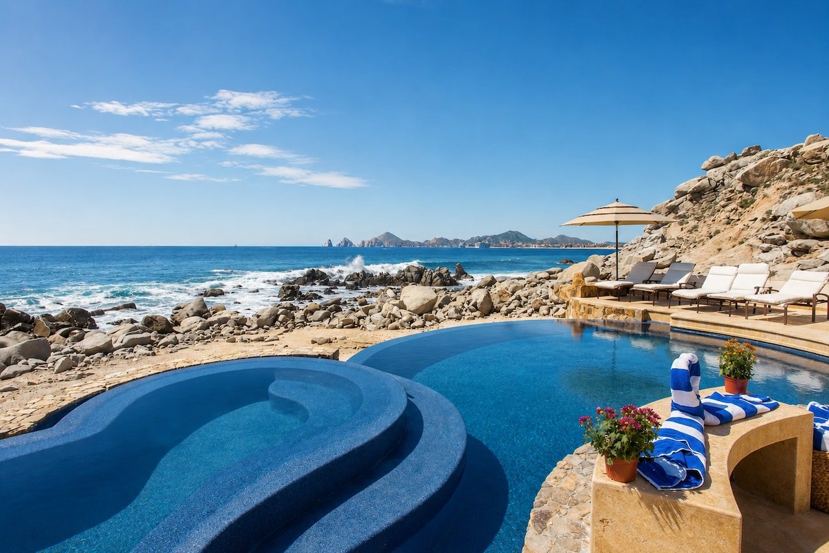 Oceanfront infinity pool and raised circular jacuzzi at Casa Luna, a private beachfront villa in Cabo