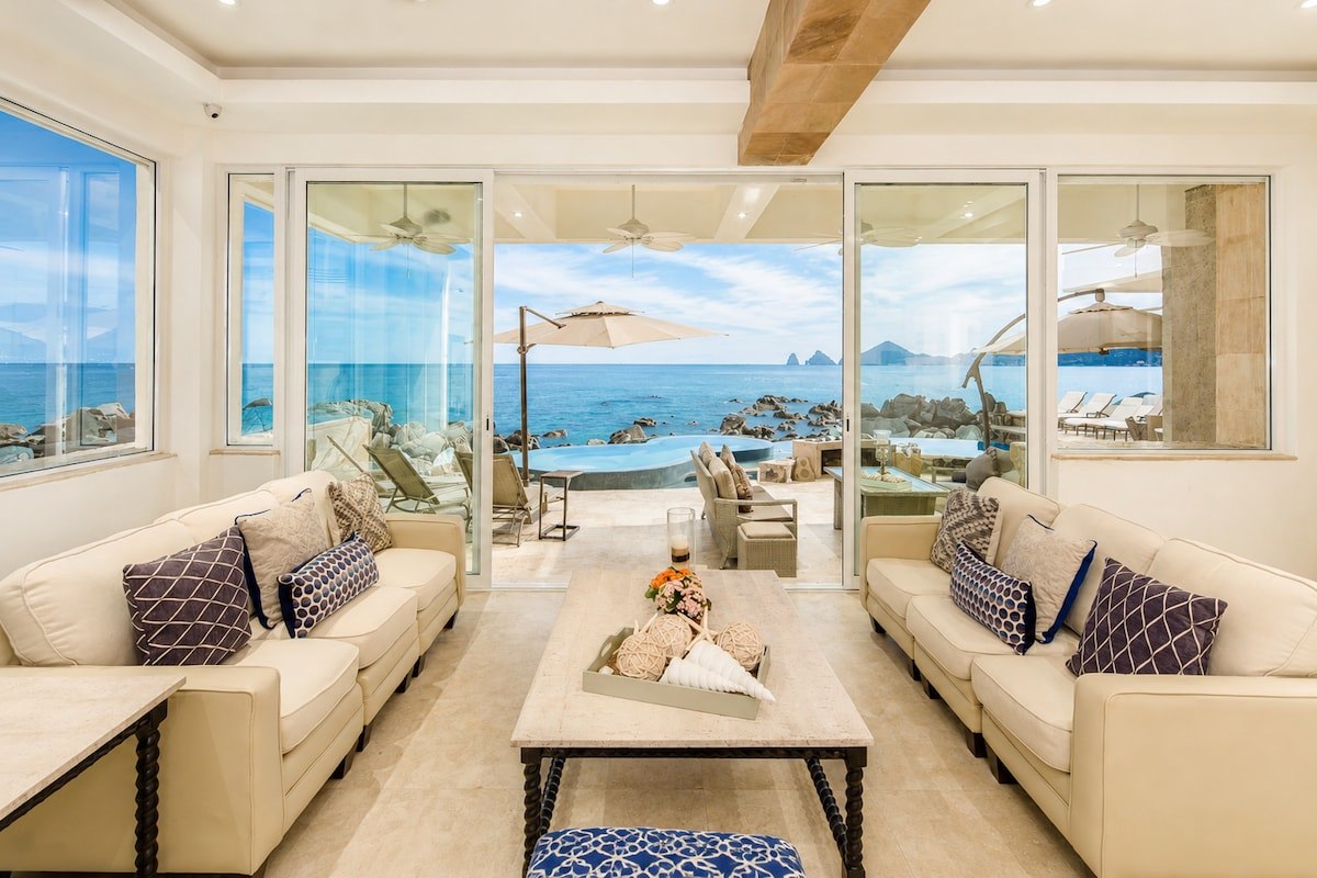 Casa Luna living room opening directly to the oceanfront pool terrace